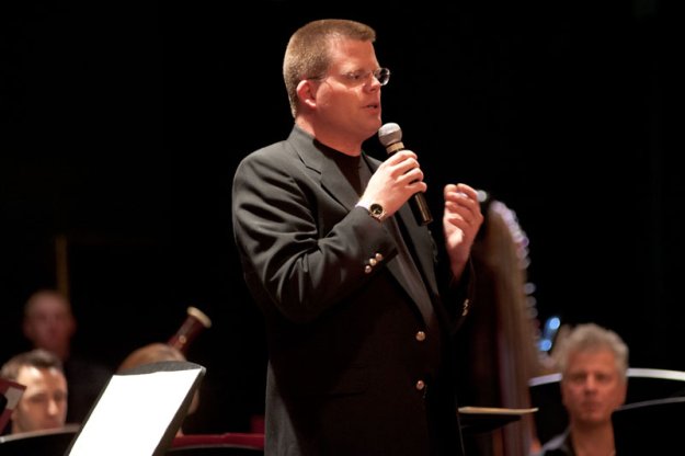 Scott Abrahamson, Director of the Dedham High School Concert Band, conducts "March to the Prince of Wales" performed by members of the Concert Band with members of the Parkway Concert Orchestra.