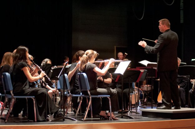 Scott Abrahamson, Director of the Dedham High School Concert Band, conducts "March to the Prince of Wales" performed by members of the Concert Band with members of the Parkway Concert Orchestra.