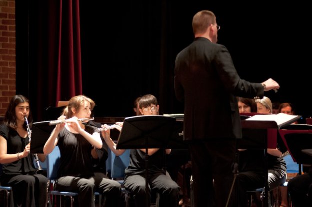 Scott Abrahamson, Director of the Dedham High School Concert Band, conducts "March to the Prince of Wales" performed by members of the Concert Band with members of the Parkway Concert Orchestra.