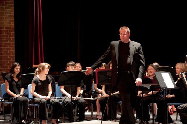 Scott Abrahamson, Director of the Dedham High School Concert Band, conducts "March to the Prince of Wales" performed by members of the Concert Band with members of the Parkway Concert Orchestra.